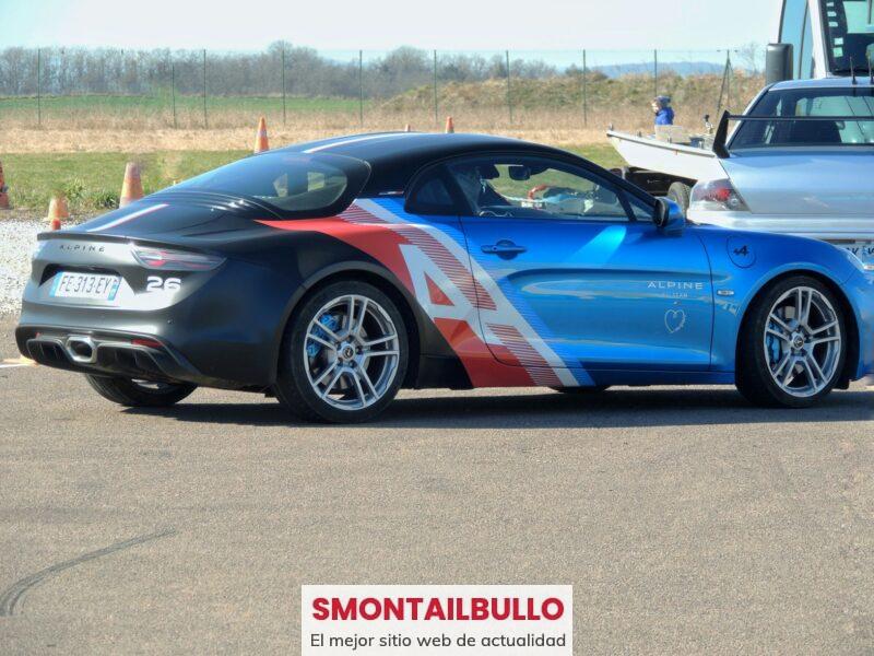 a blue sports car parked in a parking lot