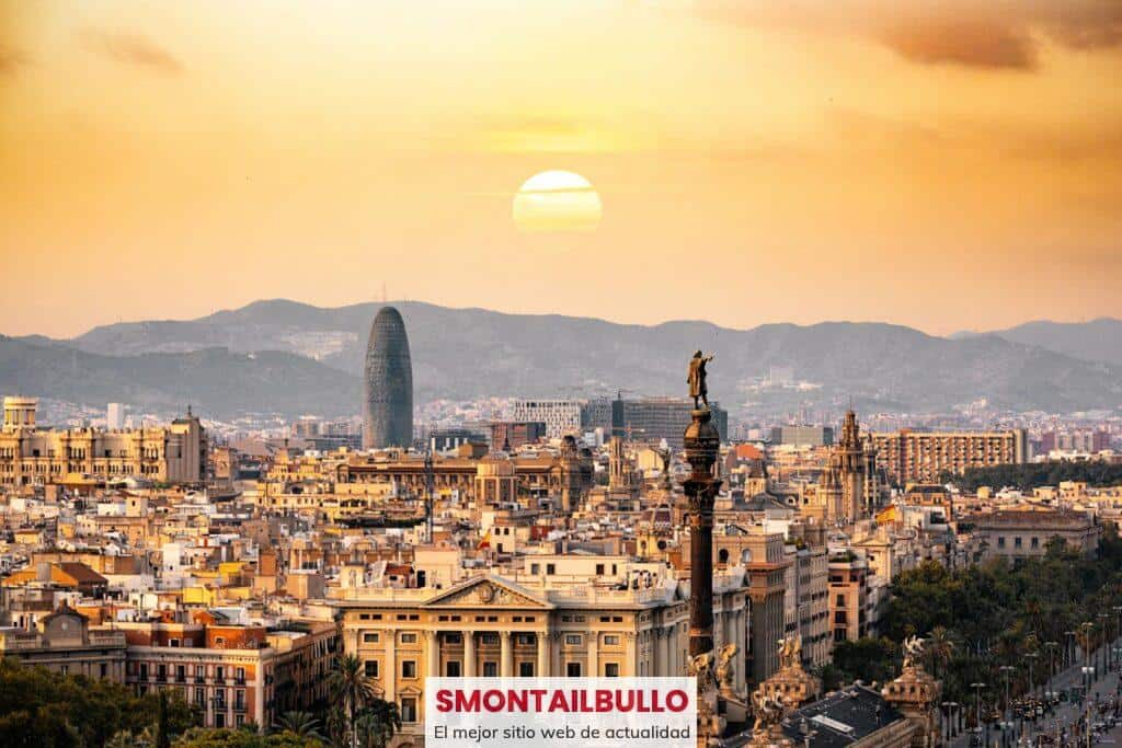 A stunning sunset view of the Barcelona skyline showcasing iconic landmarks and a warm, golden hour glow.